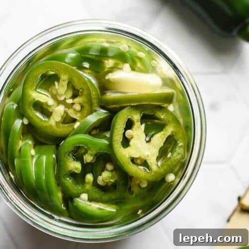 A jar of pickled pepper rings.
