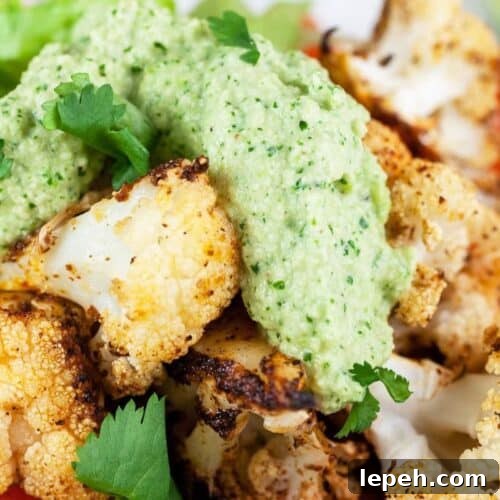 Chunks of chicken taco with cilantro cashew sauce over the top.