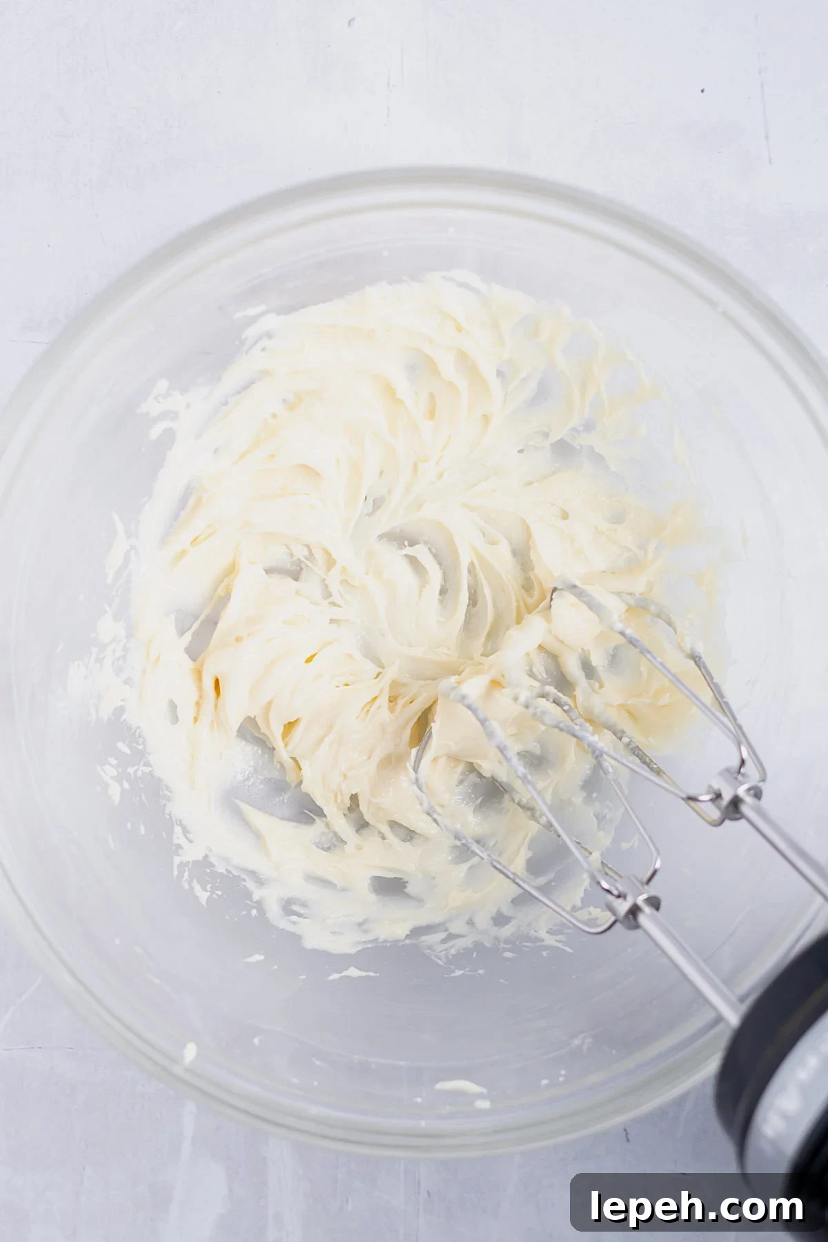 cream cheese, confectioners' sugar and vanilla mixed until smooth with a hand mixer