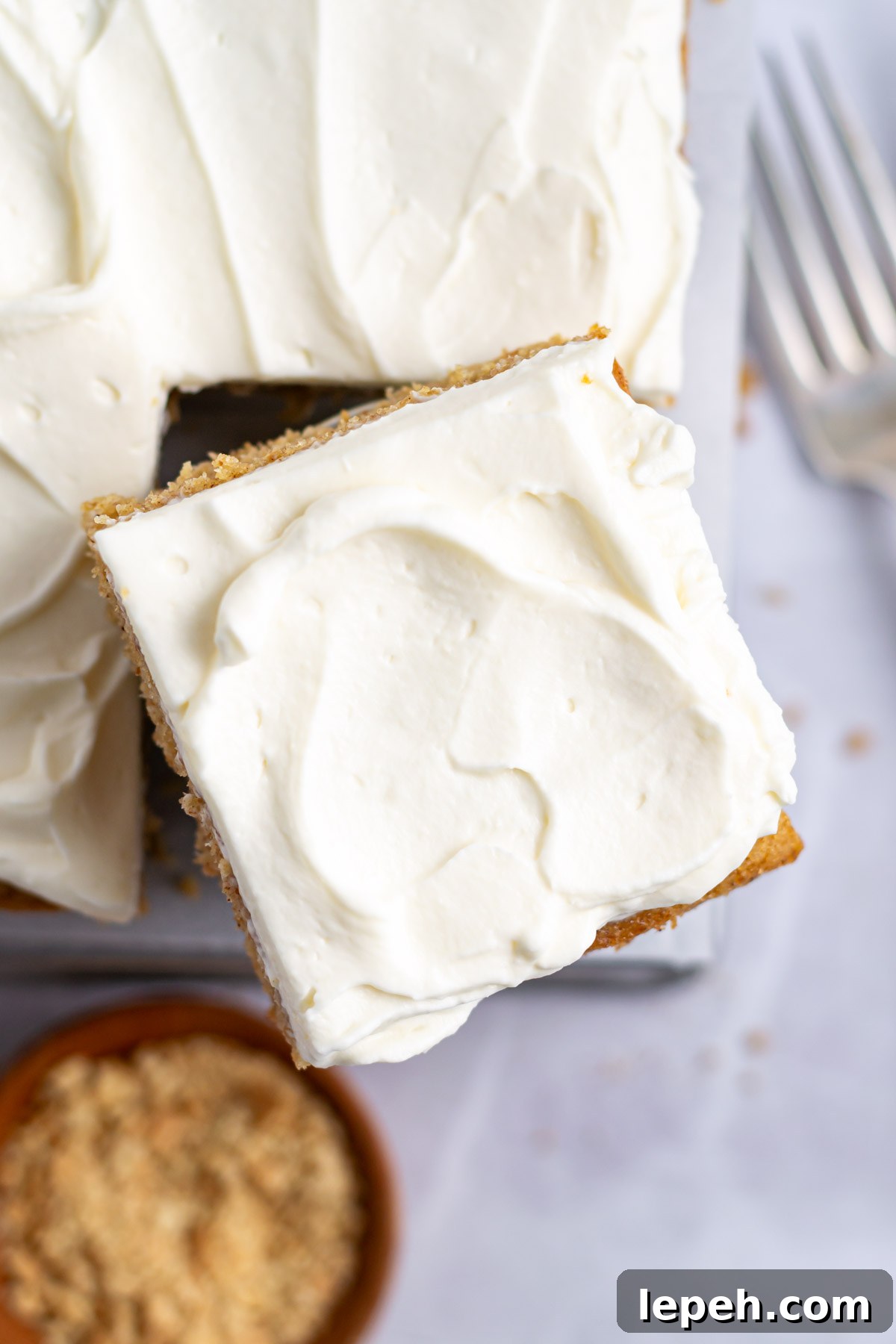 slice of graham cracker cake with frosting