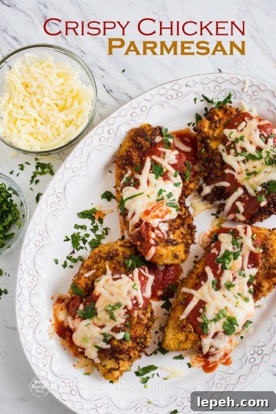 Super Easy Crispy Chicken Parmesan Recipe on a plate 