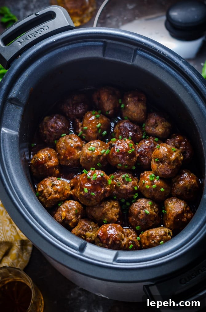 Slow Cooker Sticky Bacon & Whiskey Meatballs. These easy-to-make meatballs are smoky, sweet, and perfect for a party. | hostthetoast.com