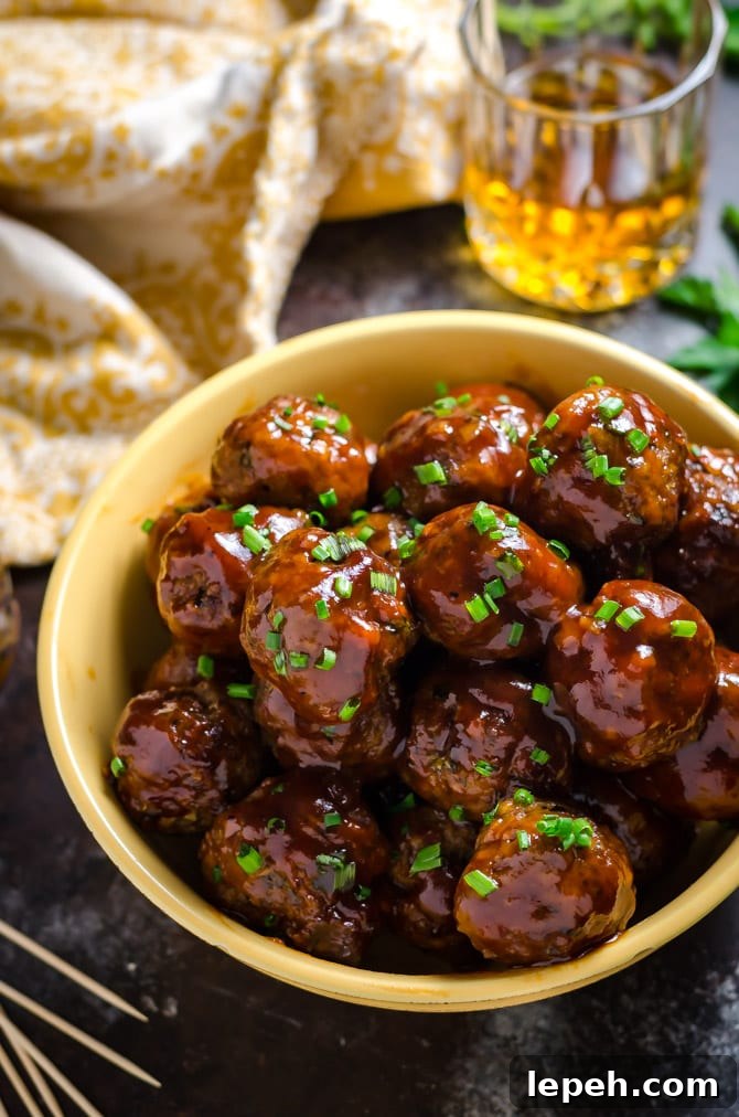 Slow Cooker Sticky Bacon & Whiskey Meatballs. These easy-to-make meatballs are smoky, sweet, and perfect for a party. | hostthetoast.com