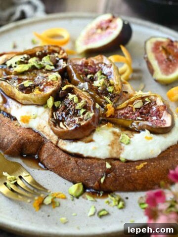 Close-up of fig toast on a beige plate.