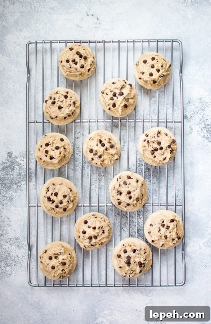 vegan chocolate chip sugar cookies with frosting on a wire rack