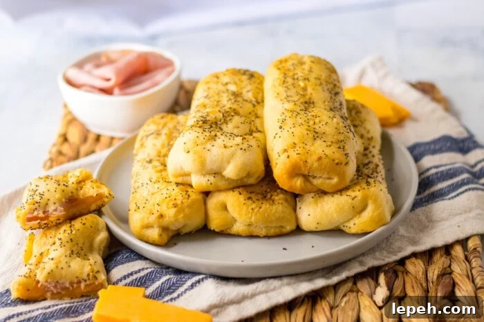 Ham and Cheese Sticks on a grey plate.