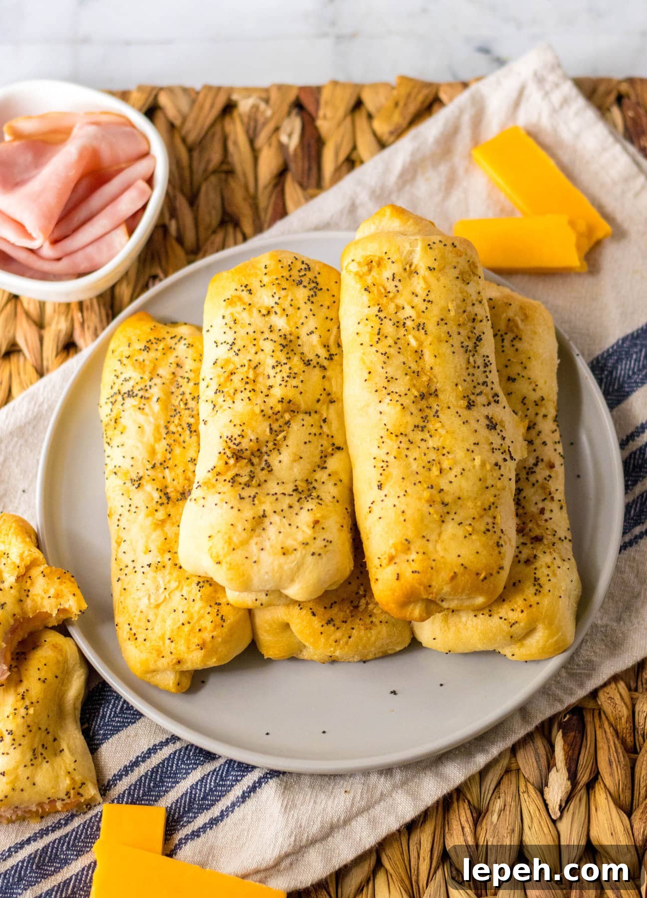 Ham and Cheese Sticks in a pile on the plate.