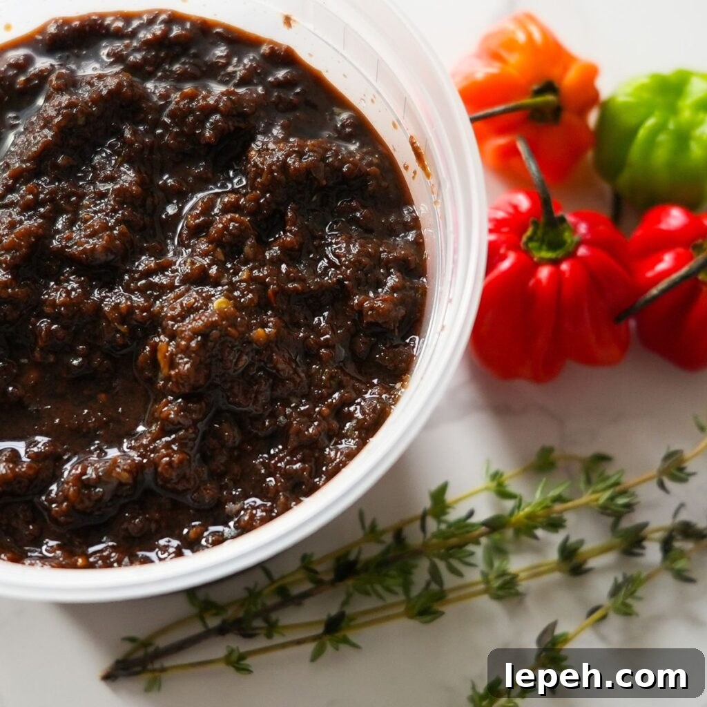 Jerk marinade with peppers and thyme on the side.