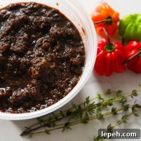 Jerk marinade with peppers and thyme on the side.