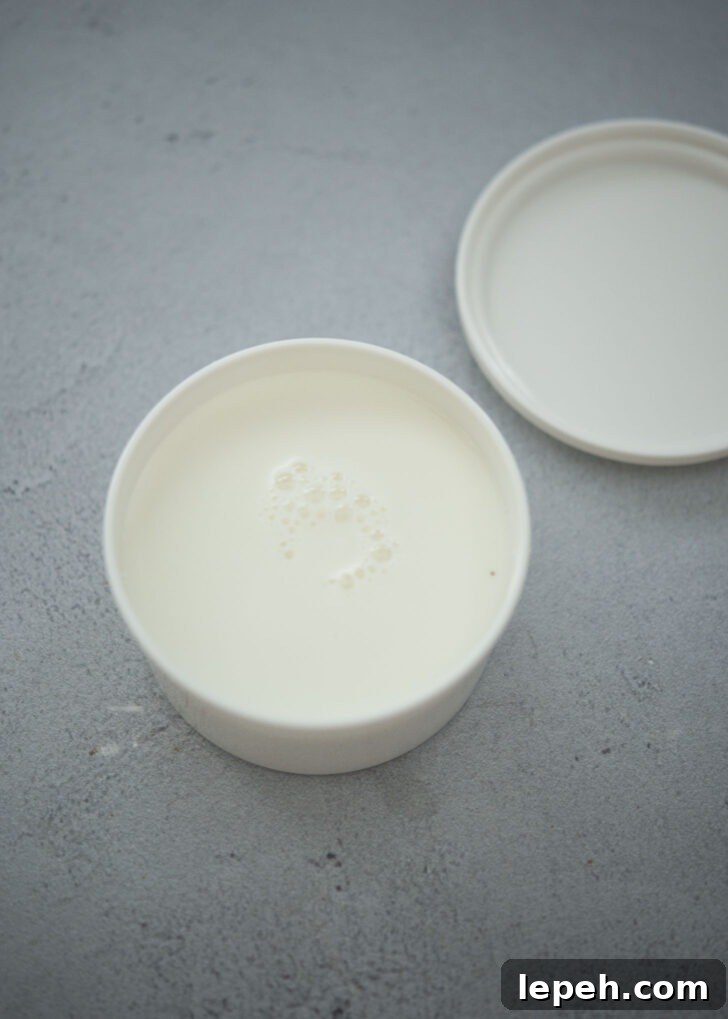 Milk mixture in a round ice mold container