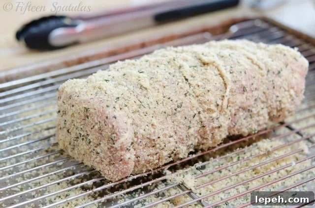 boneless pork loin coated with rosemary bread crumbs on Wire Rack
