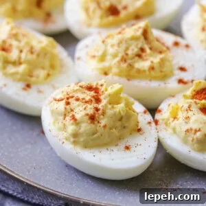 Deviled eggs topped with paprika