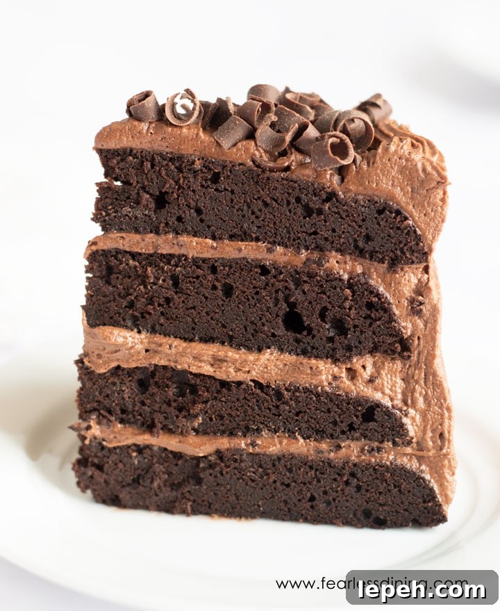 A piece of chocolate plate standing up tall on a plate.