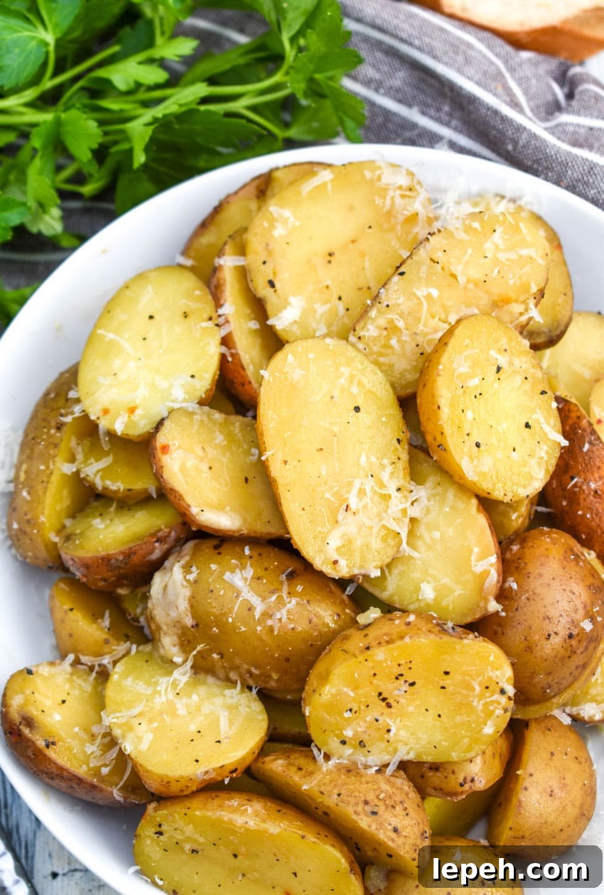 instant pot italian potatoes in a small white serving bowl