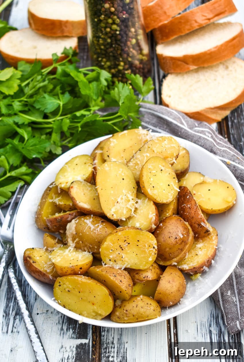 instant pot italian potatoes in a small white serving bowl