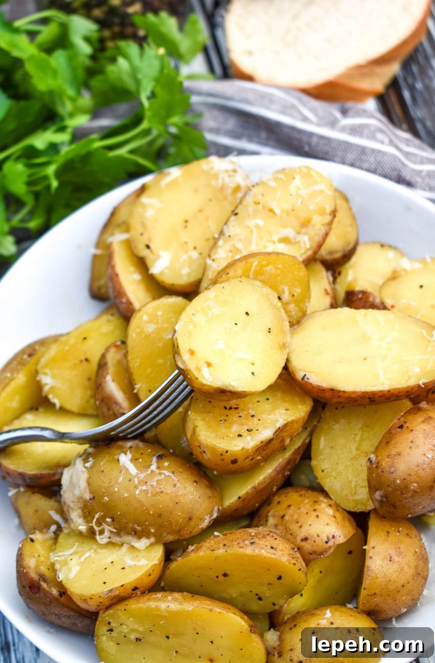 instant pot italian potatoes in a small white serving bowl