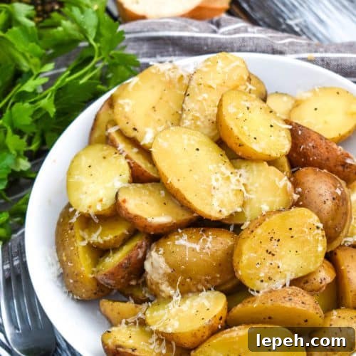 instant pot italian potatoes in a small white serving bowl