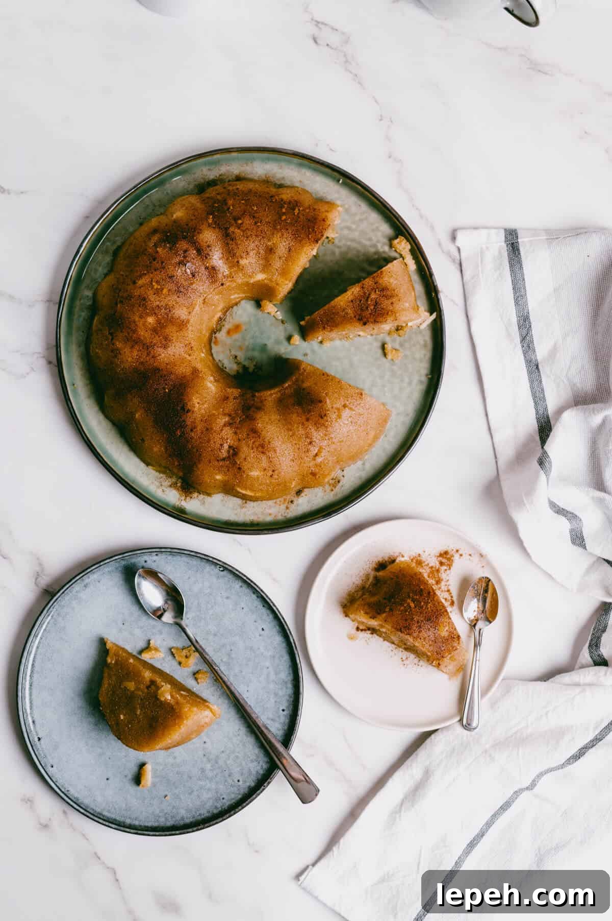 birds eye view of Greek semolina halva sliced and served on plates.
