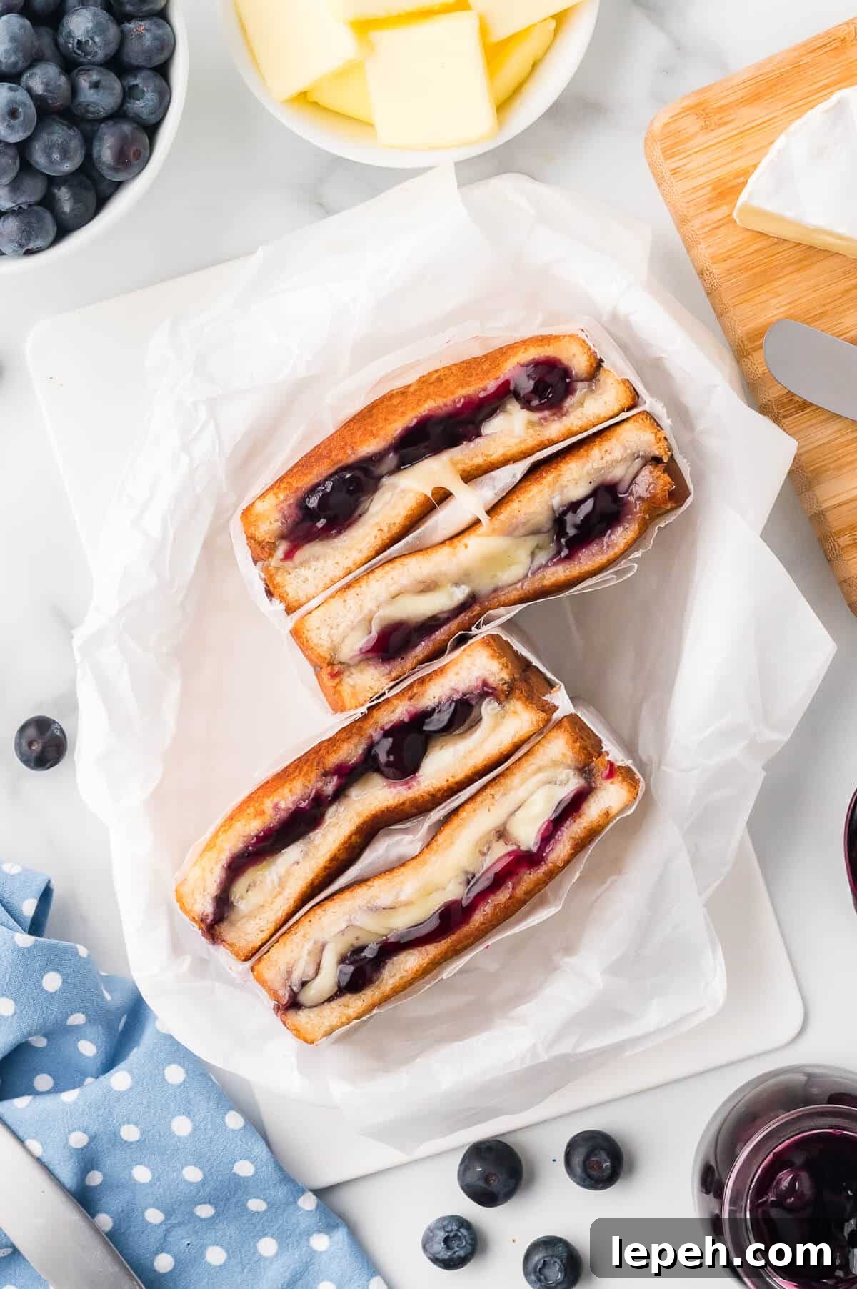 A blueberry brie grilled cheese in parchment paper.