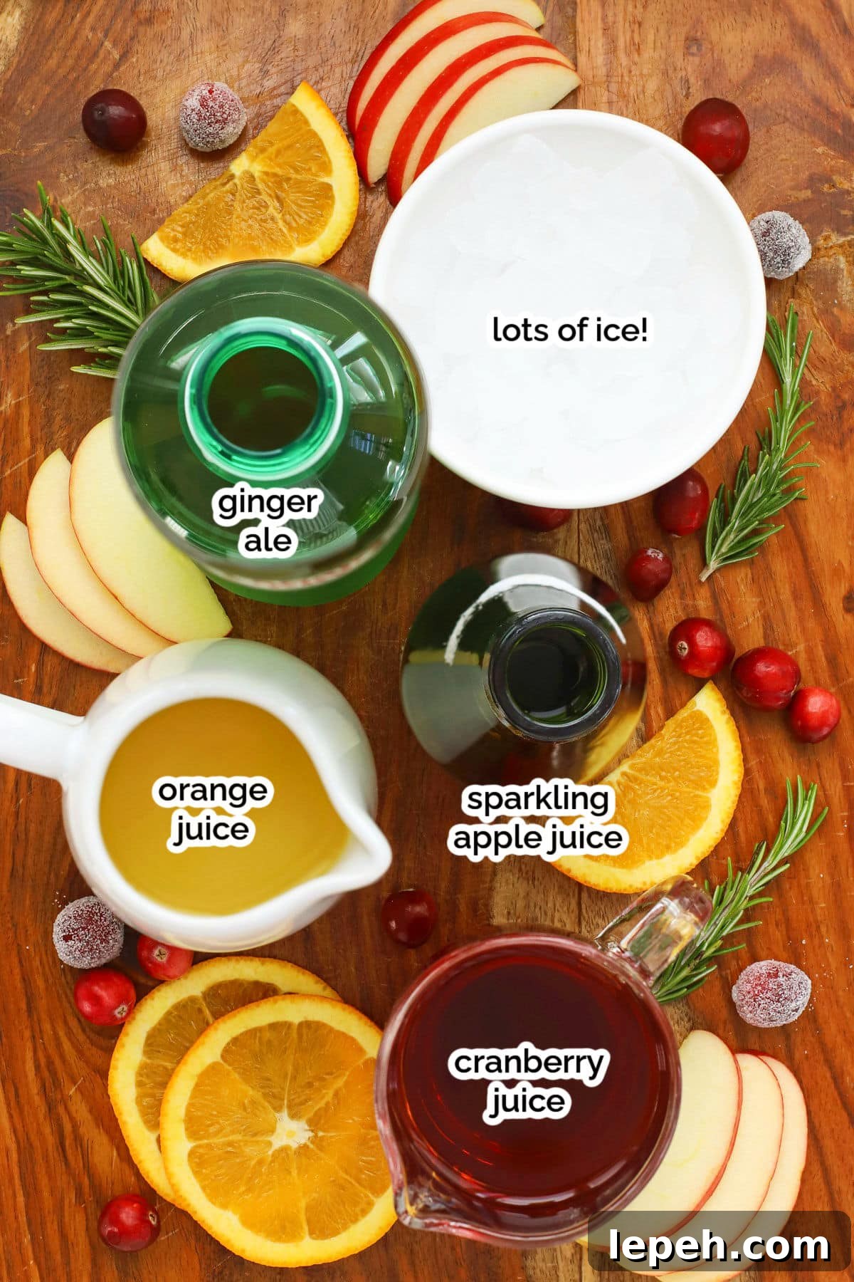 Holiday punch ingredients on a wooden cutting board
