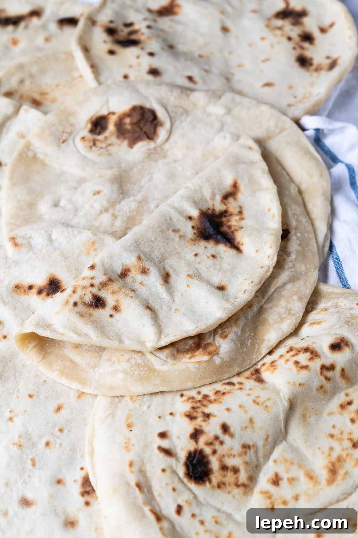 A pile of easy flatbreads, one folded in half.