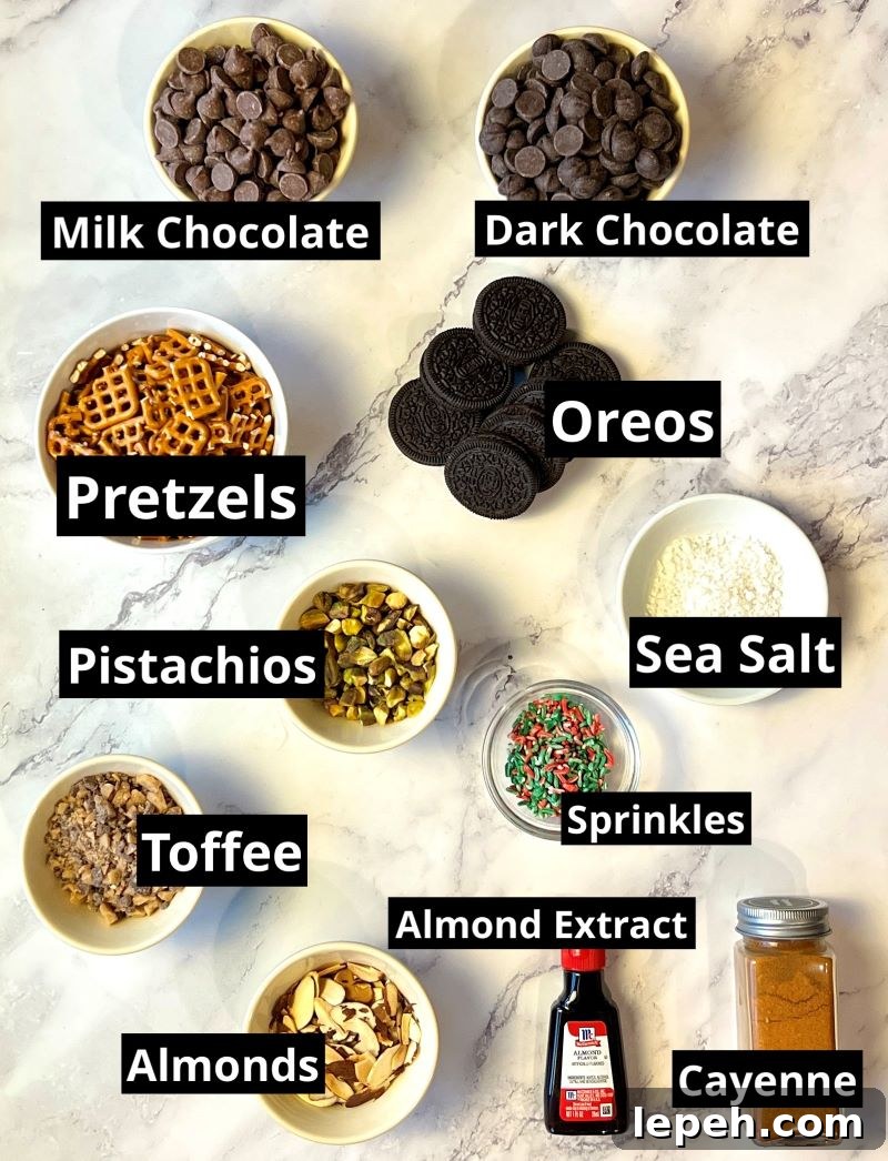 Ingredients list. Milk chocolate chips, dark chocolate chips, pretzels, Oreos, pistachios, sea salt, Christmas sprinkles, toffee pieces, sliced almonds, almond extract, and cayenne pepper.
