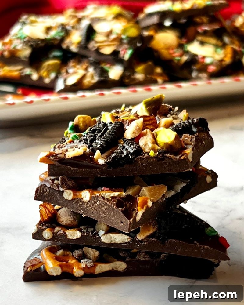 Cowboy Chocolate Christmas Bark broken in pieces and stacked in fours.