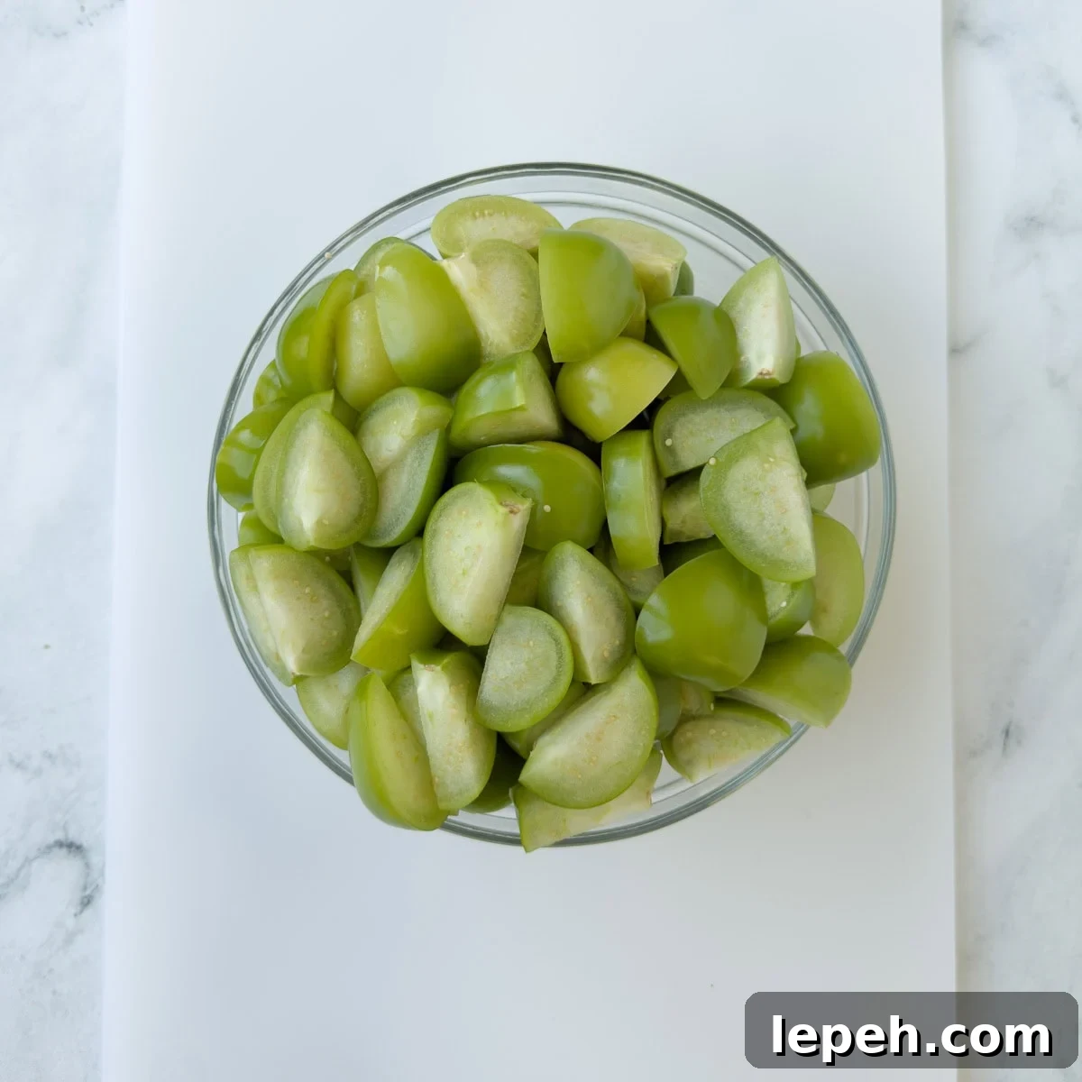 Chopped green tomatillos ready to make enchilada sauce