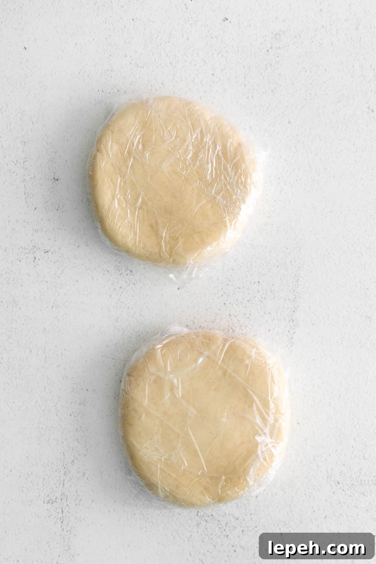 dough wrapped in plastic wrap.