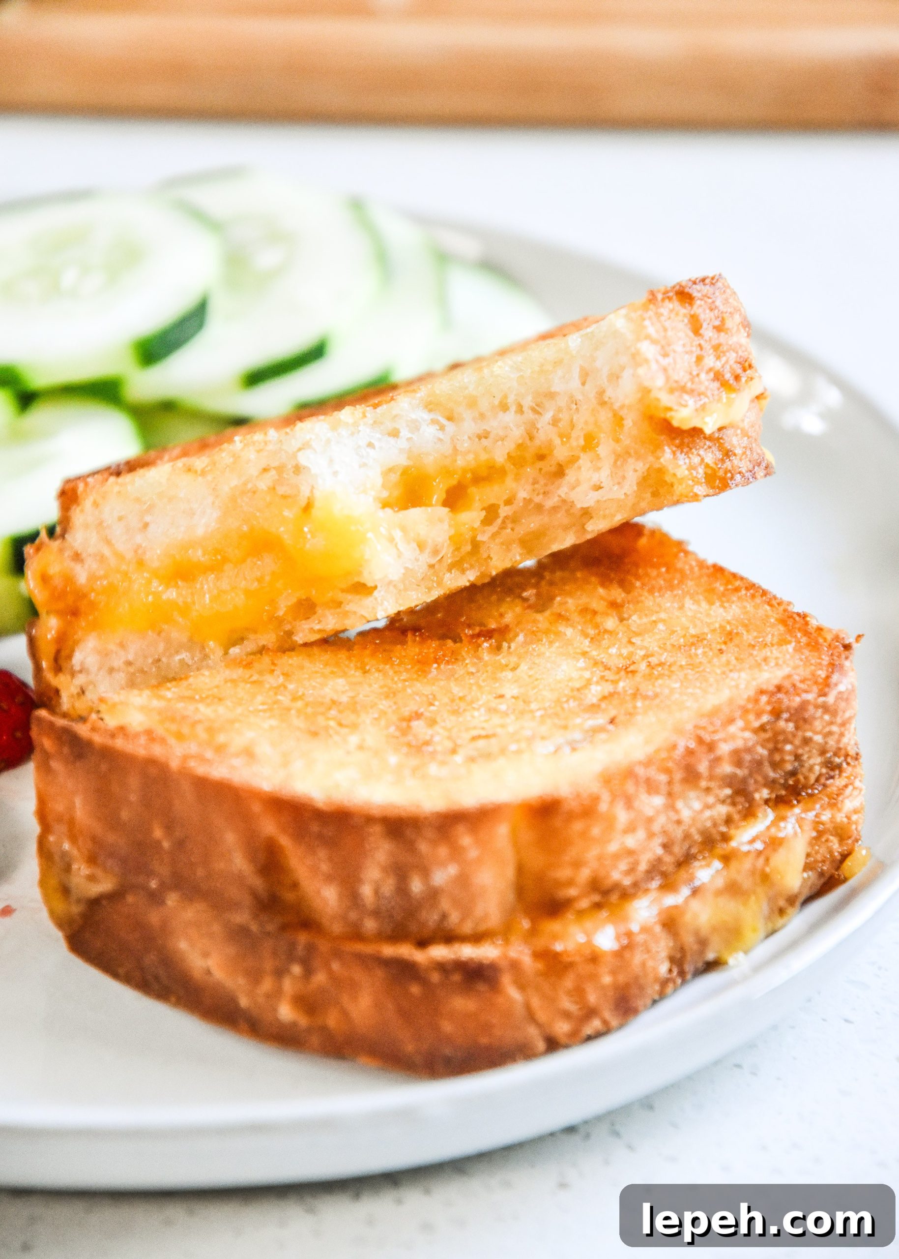 air fryer grilled cheese sandwich with a bite out of it