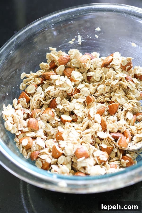 granola ingredients in a glass bowl.