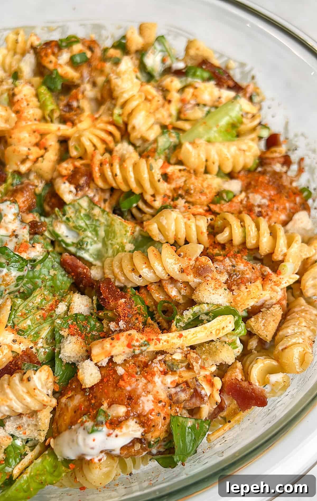 Overhead view of a bowl of chicken bacon ranch pasta salad