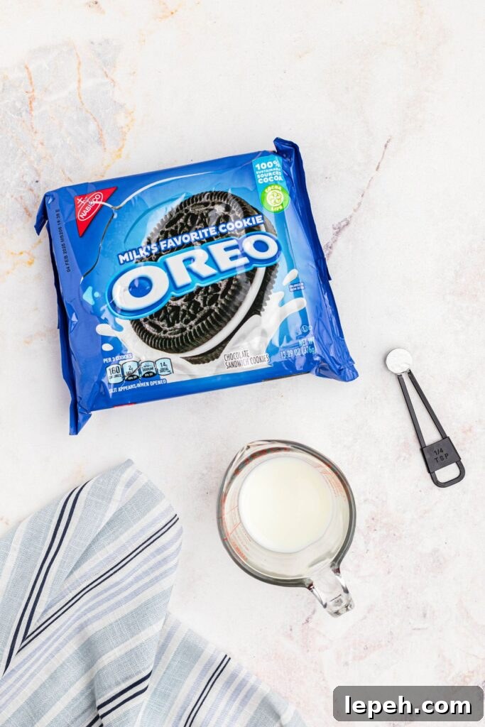 Oreos, milk, and baking powder measured out on the marble table. 