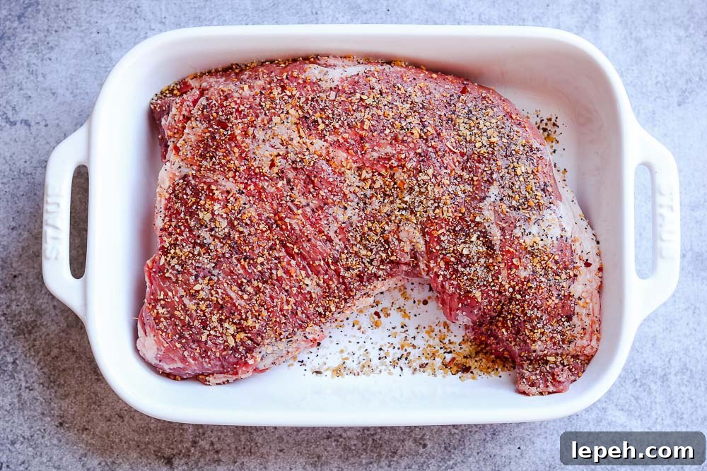 tri tip with seasoning in dish
