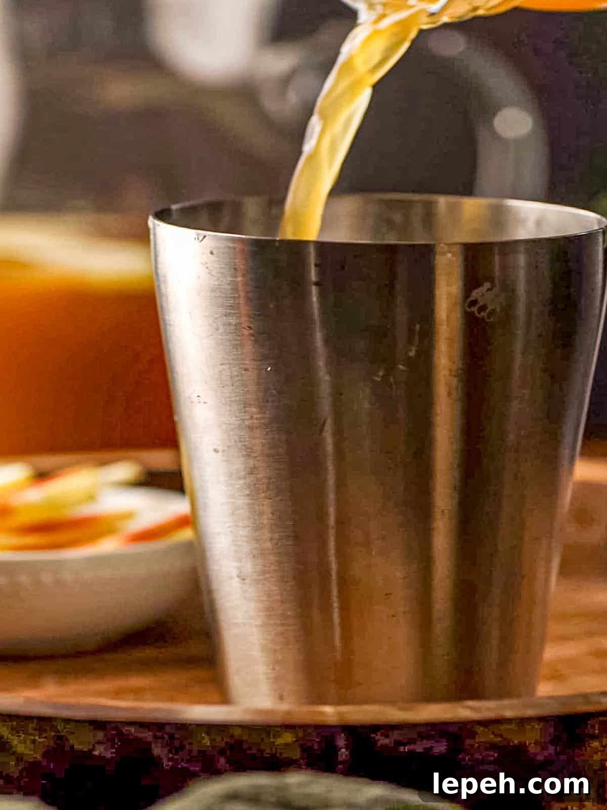 Apple cider being poured.