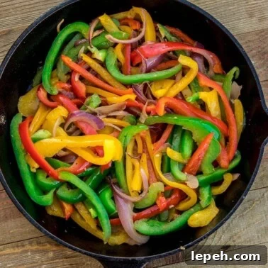 Sauteed peppers and onions in a skillet
