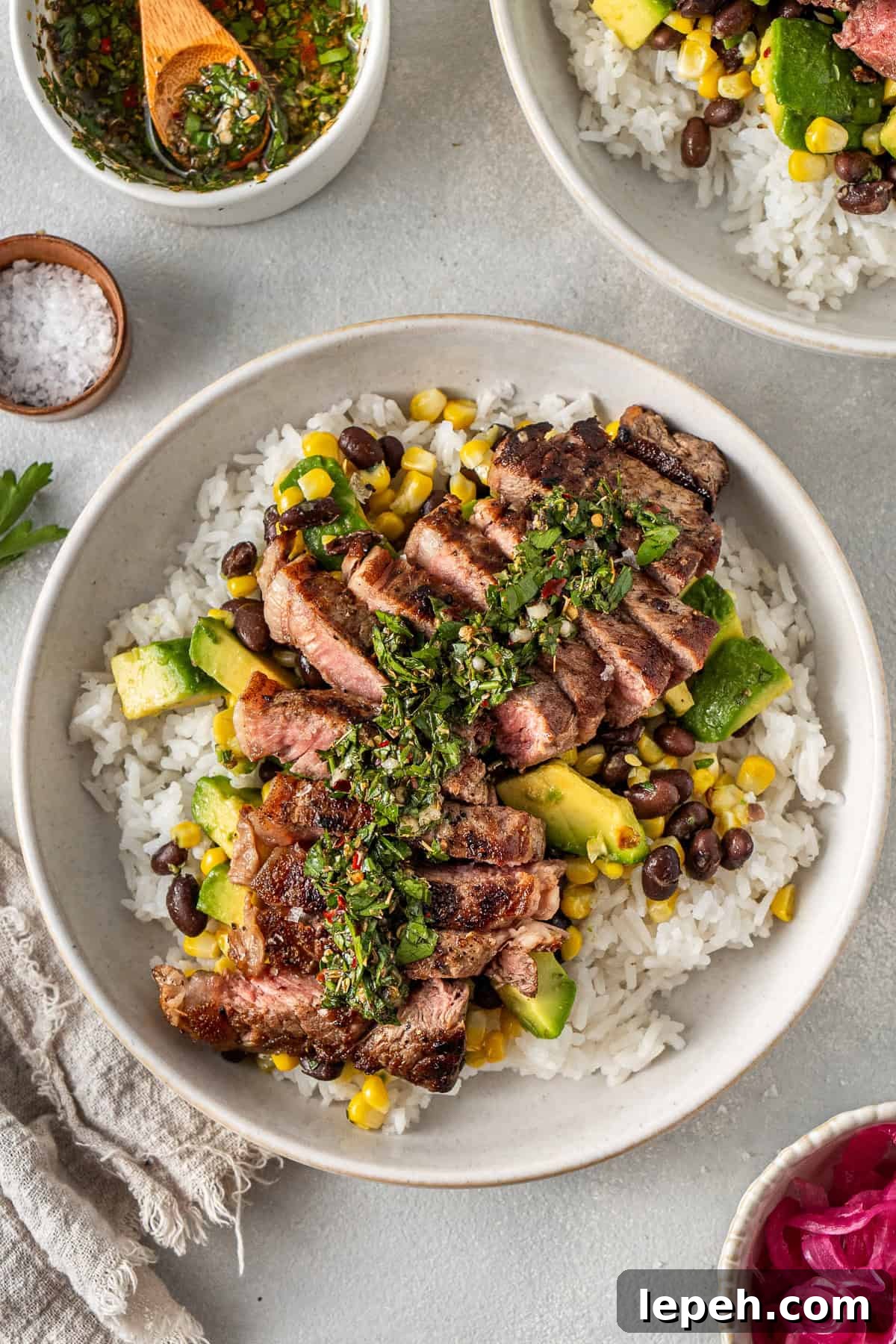 Steak rice bowl with chimichurri and avocado corn salsa. 