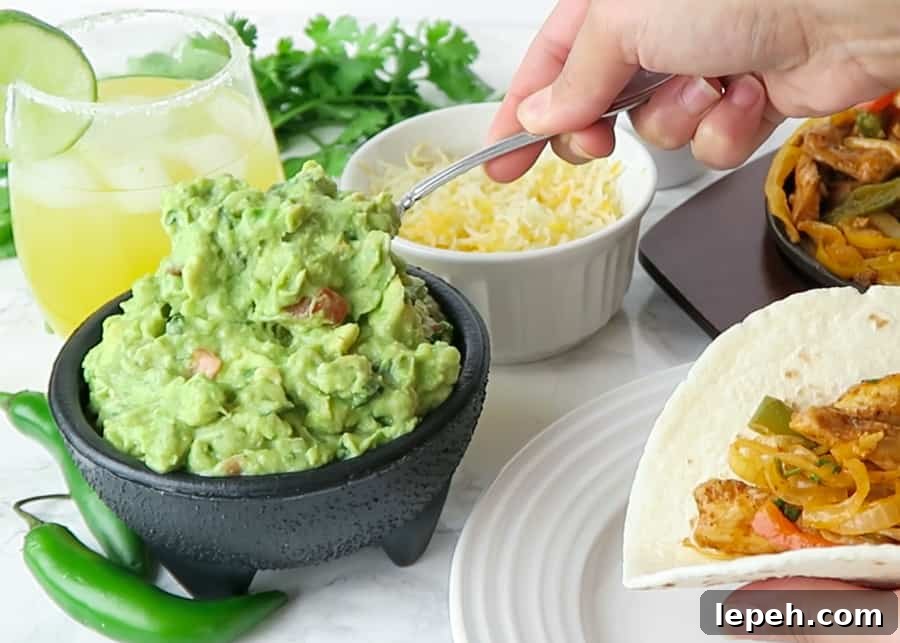 authentic guacamole being served on a taco