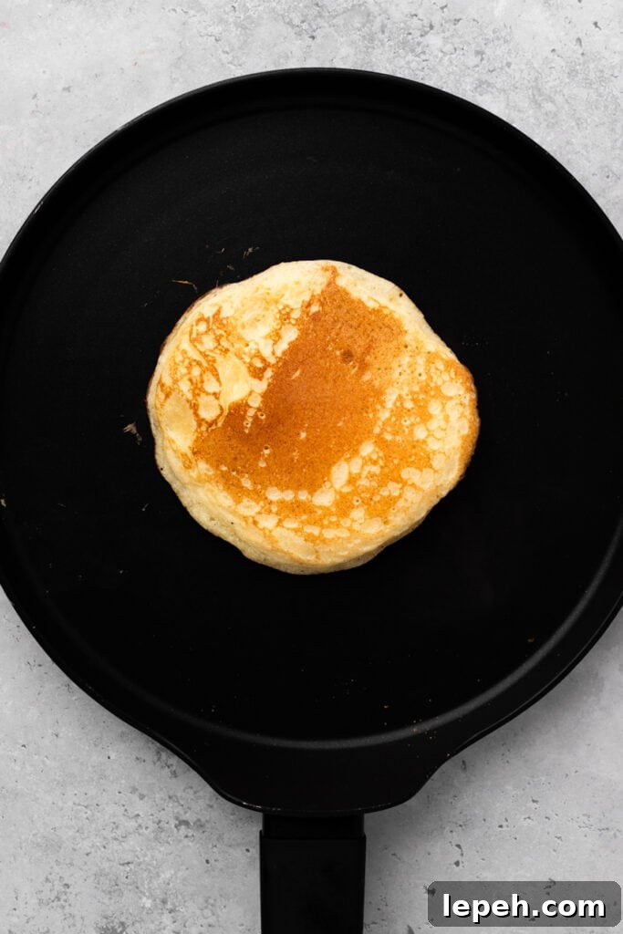 Gluten free pancake being cooked on a griddle