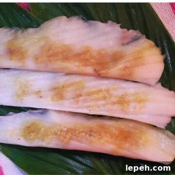 5 patoli served on turmeric leaves.