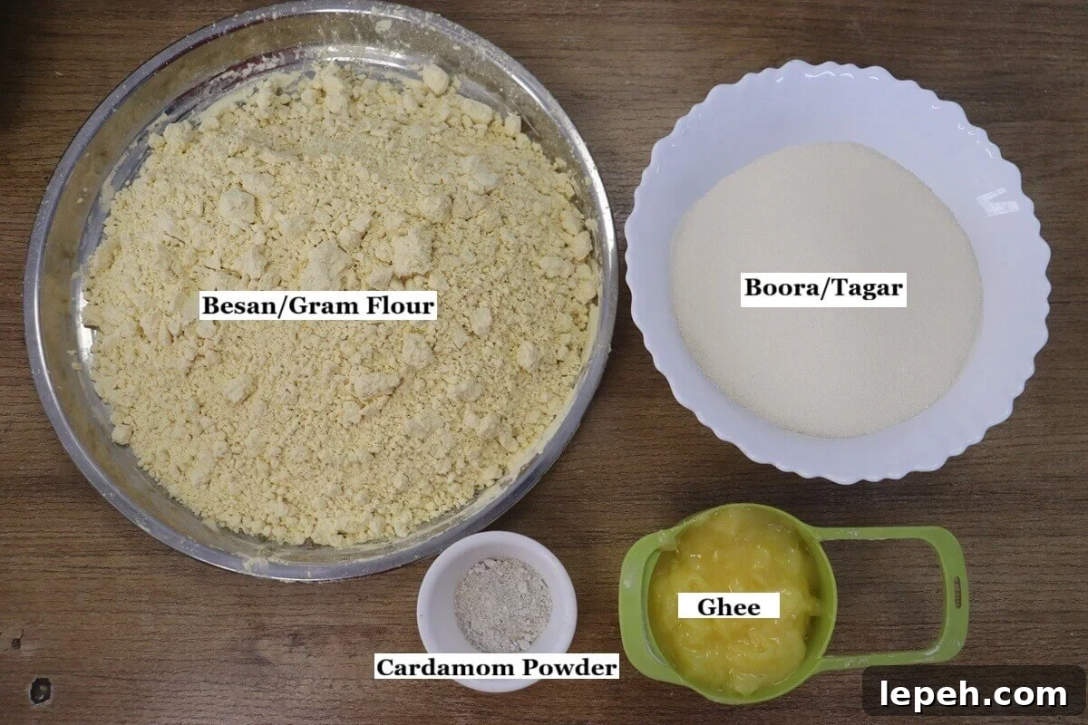 individually labeled ingredients to make besan ladoo recipe are laid out on a table.