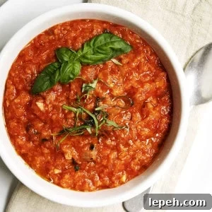Pappa al Pomodoro served in a white bowl on a linen napkin