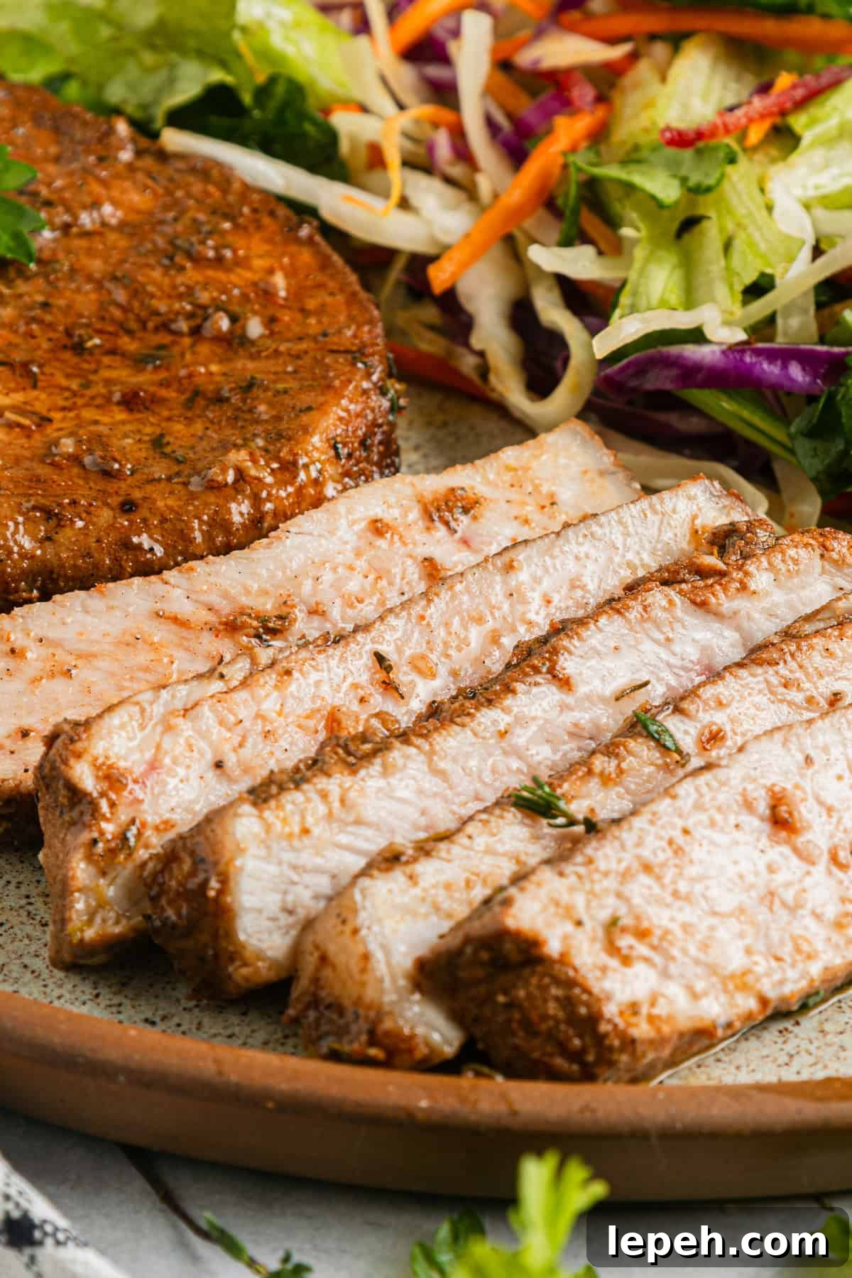 Sliced pork chop on a plate.