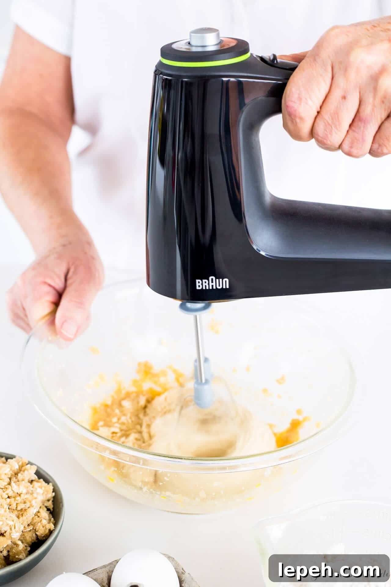 Mixing cake batter with a hand mixer—Alternating wet and dry ingredients to make cake
