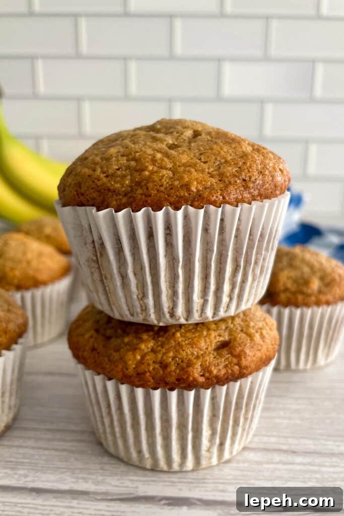 Easy banana muffins stacked on top of each other.