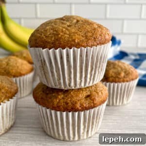 Easy banana muffins stacked on top of each other.