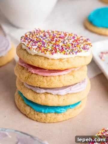 A stack of sour cream cookies with vanilla buttercream frosting.