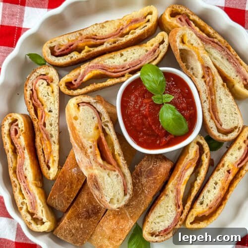 Whole stromboli on a serving platter ready to slice