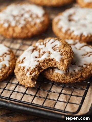 an iced gluten free oatmeal cookie with a bit taken out