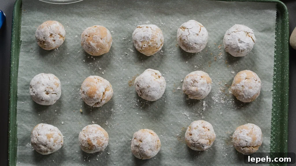 Amaretti cookies recipe on a cookie sheet just out of the oven.